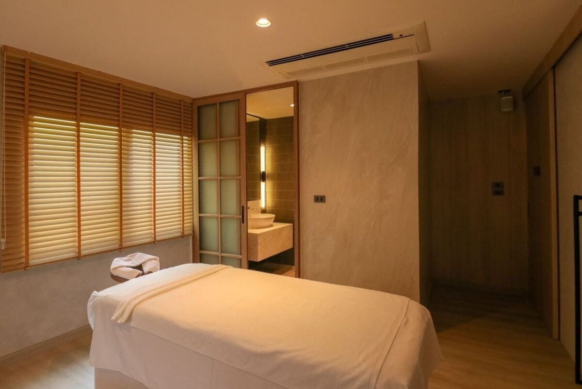 Massage room with wood accents at Makkha Health & Spa Bangkok (BTS Asok)